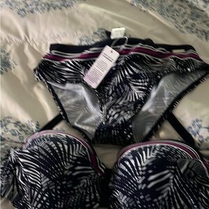 Multi color bathing suit, to 36D and bottom is size 6. Brand new with tags